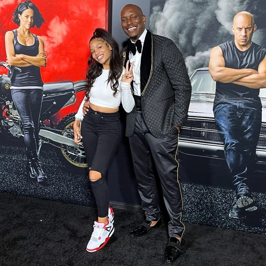 Tyrese-Gibson-with-one-of-his-daughters-Shayla-attending-Fast-Furious-red-carpet